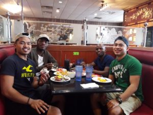 Bongani and Lindelihle dining out with their Filipino fellow interns, housemates